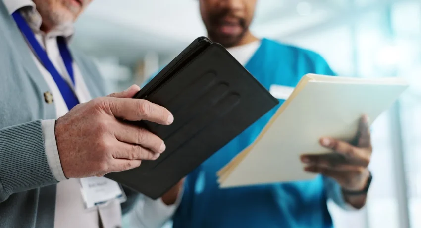 healthcare-nurse-hands-with-tablet-collaboration-professional-with-documents-clinic-medical-paperwork-reading-report-records-info-form-people-manager-hospital