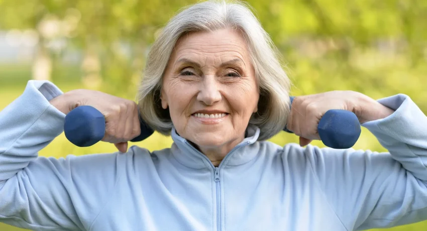 mature-woman-with-dumbbells-park