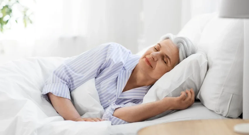 senior-woman-sleeping-bed-home-bedroom